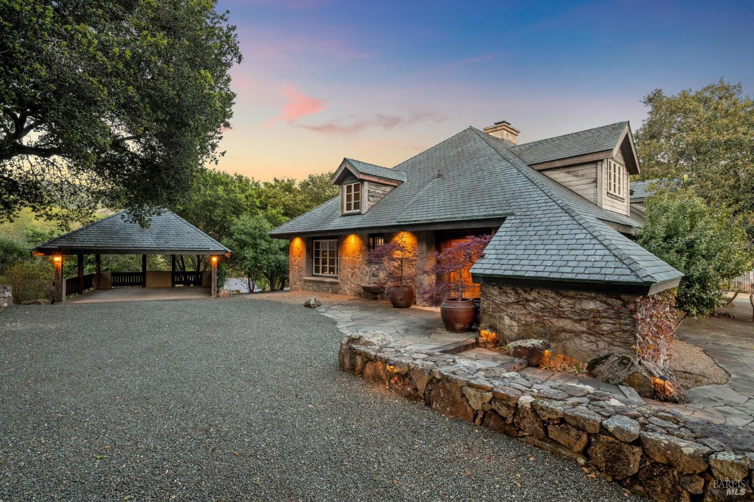 The Stone House at dusk at the end of a private drive on the 187-acre estate